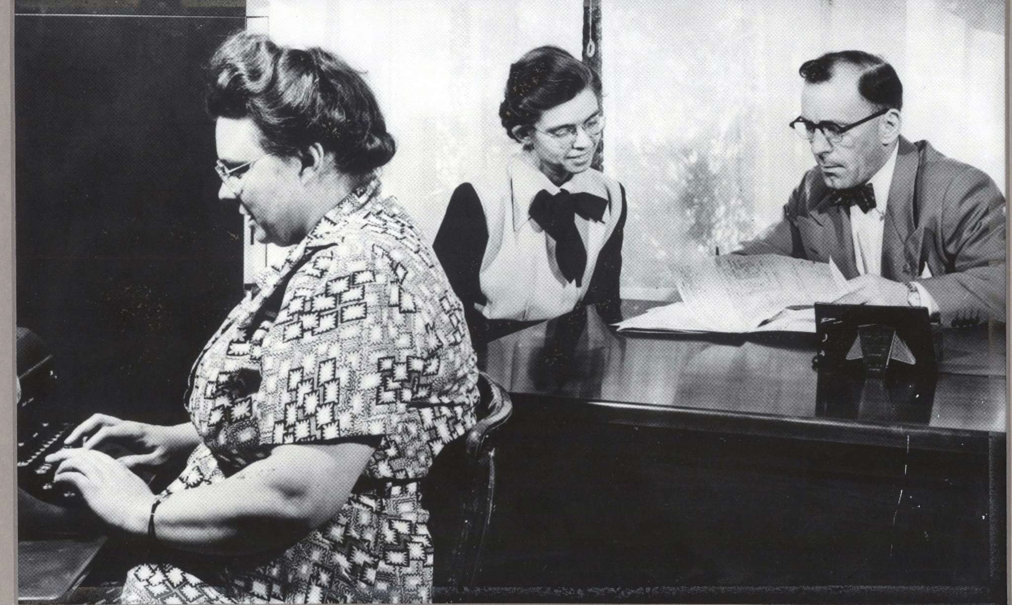 Bethany original staff working on a case file.