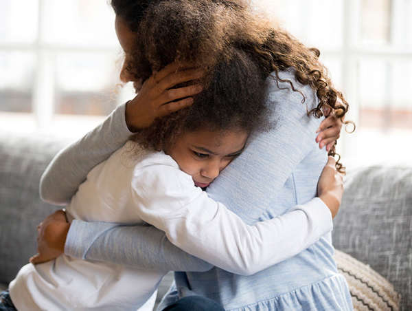 mother hugs her daughter after reuniting as a stronger family