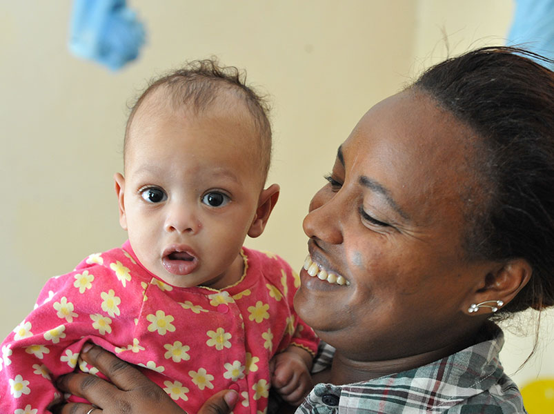 ethiopian mother holds her adopted baby