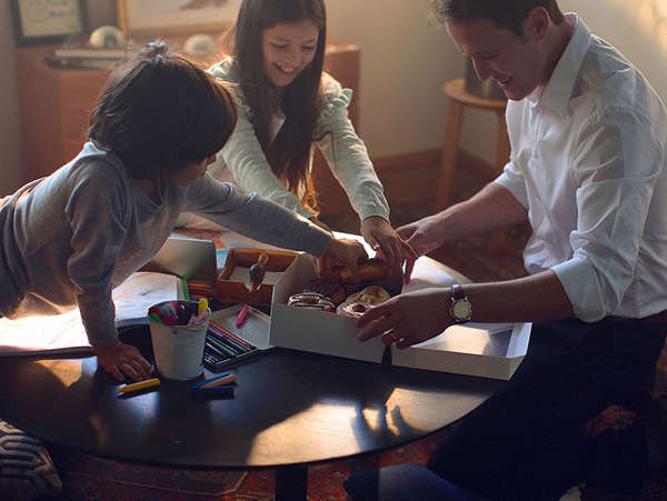 adoptive family eats doughnuts at the kitchen table