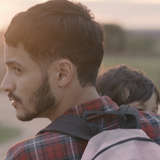 Venezuelan refugees, a young mother and father carry child