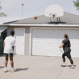 Foster mom plays basketball in the driveway with two foster youth boys