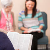 women with Bibles in a seated circle