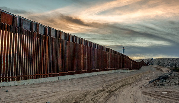 the large, metal wall dividing the border between mexico and U.S.