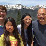 diverse family joined through adoption takes a vacation in the mountains