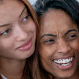 An African American foster mom with two teen girls 