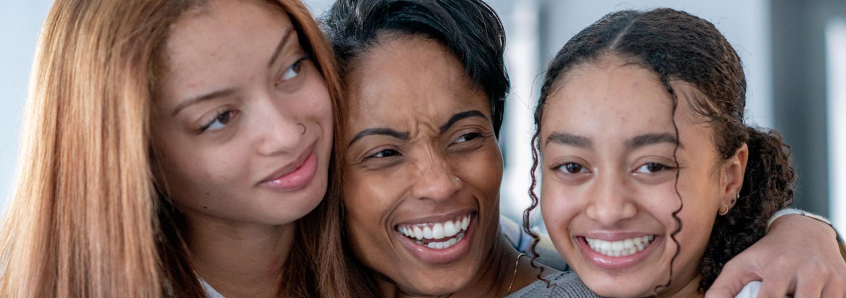 An African American foster mom with two teen girls 