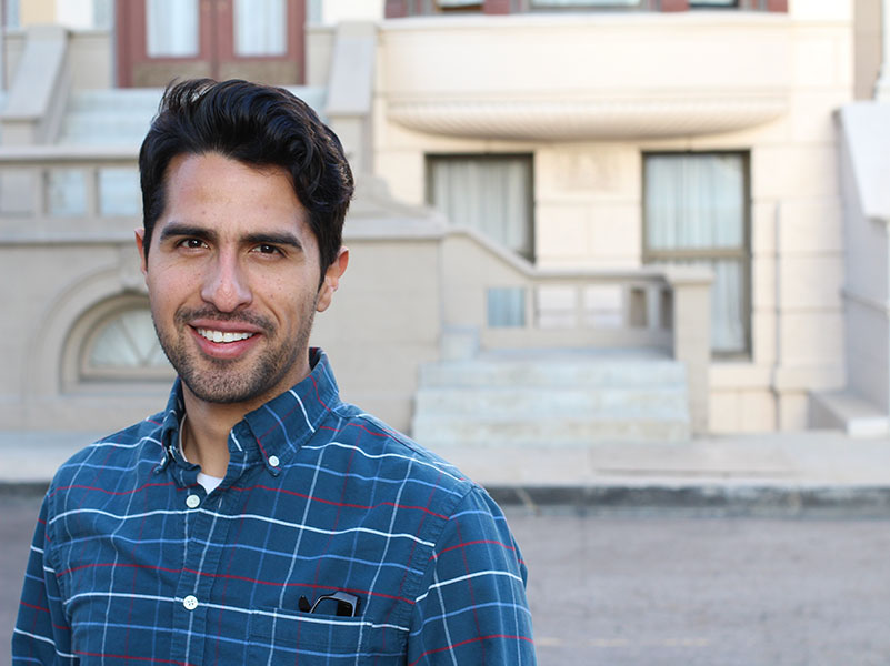 male Afghan refugee walks to college in his new home in america