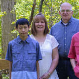 diverse family poses for outdoor portrait